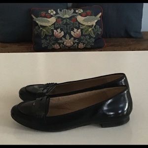 Black leather penny-style loafers
